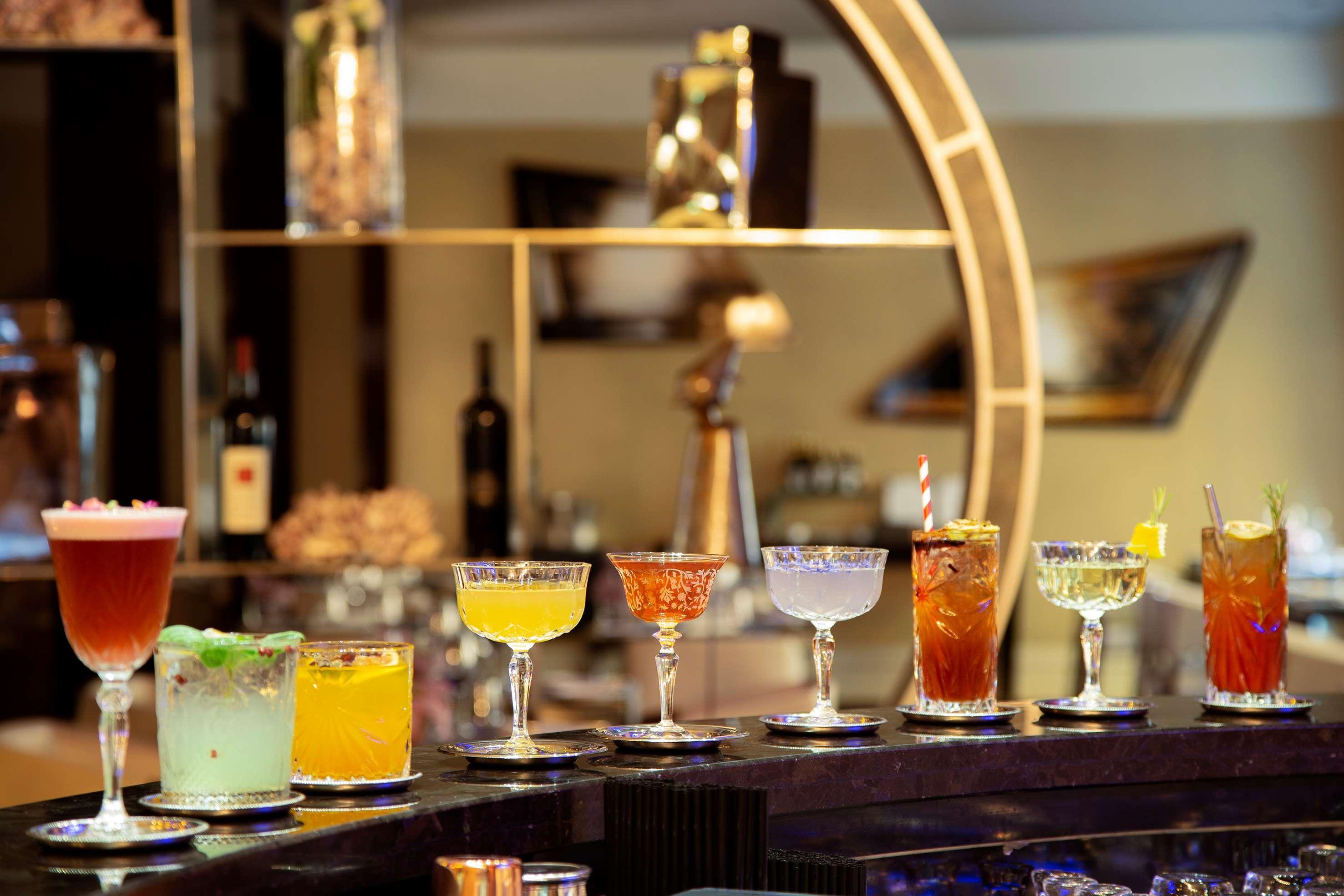 Melia Genova Hotel Bagian luar foto A selection of cocktails